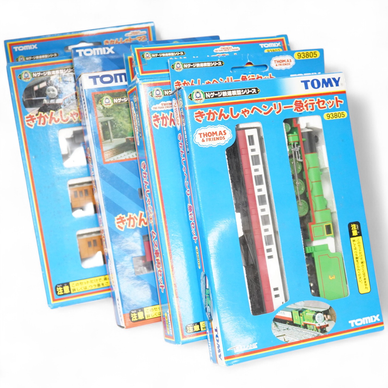 Four boxed Tomix (by Tomy) N gauge railway Thomas the Tank Engine & Friends train packs, comprising of three locomotives and rolling stock (one locomotive and a wagon missing): James (93802) - James and one wagon missing